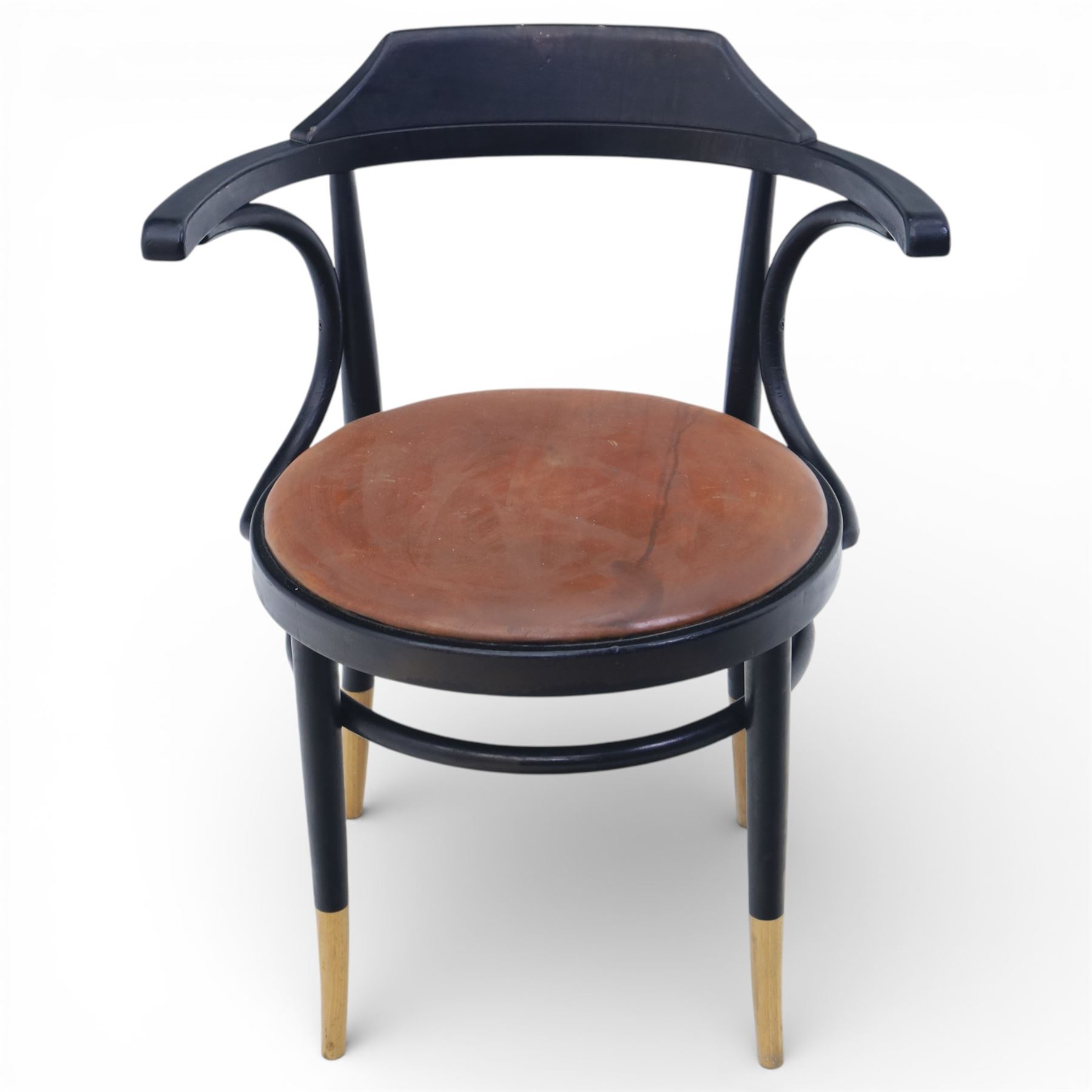 Thonet - 20th century ebonised elbow chair, bentwood construction with a circular brown leather seat, tapering legs with exposed wood supports