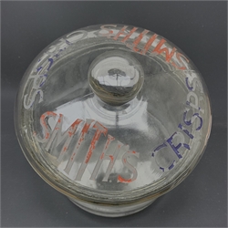 An early 20th century Vintage Smith’s Crisps glass counter top jar, of cylindrical form, the removable domed cover with compressed bun finial inscribed Smith’s Crisps, the body with moulded detail ‘This jar is the property of the Smith’s potato crisps 1929 Ltd’, H25.5cm. 