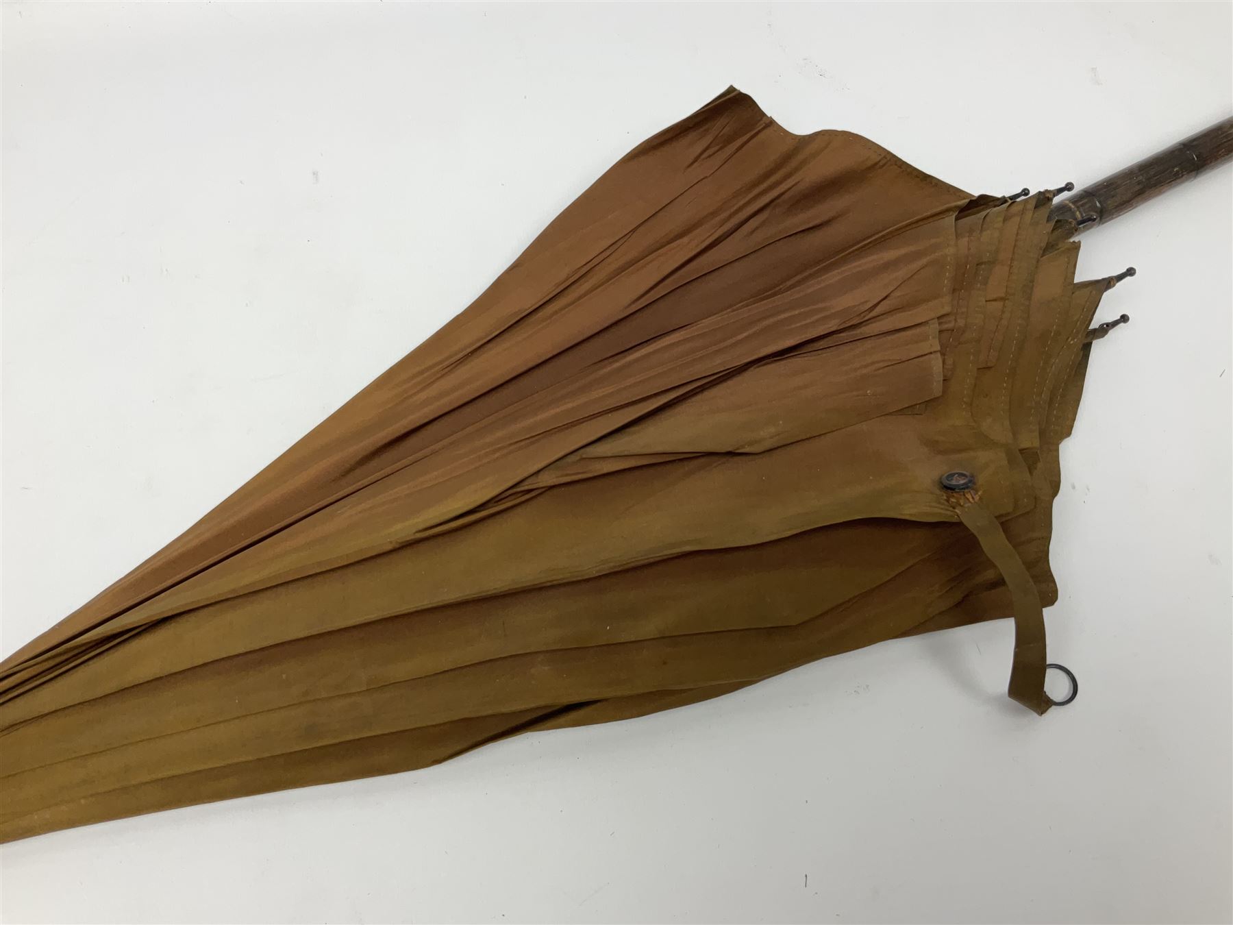 Edwardian novelty parasol by Briggs of London, the bamboo shaft with brown fabric canopy, and silver mounted terminal concealing a silver mounted pencil, hallmarked Charles Henry Dumenil, London 1904, also marked Briggs, H93cm