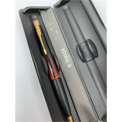 A group of pens, comprising Parker Duofold Centennial pearl and black ballpoint pen, Parker Frontier ballpoint pen, Ronson Penciliter, in original box, Parker Rialto fountain pen, and a further unmarked ballpoint. (5). 
