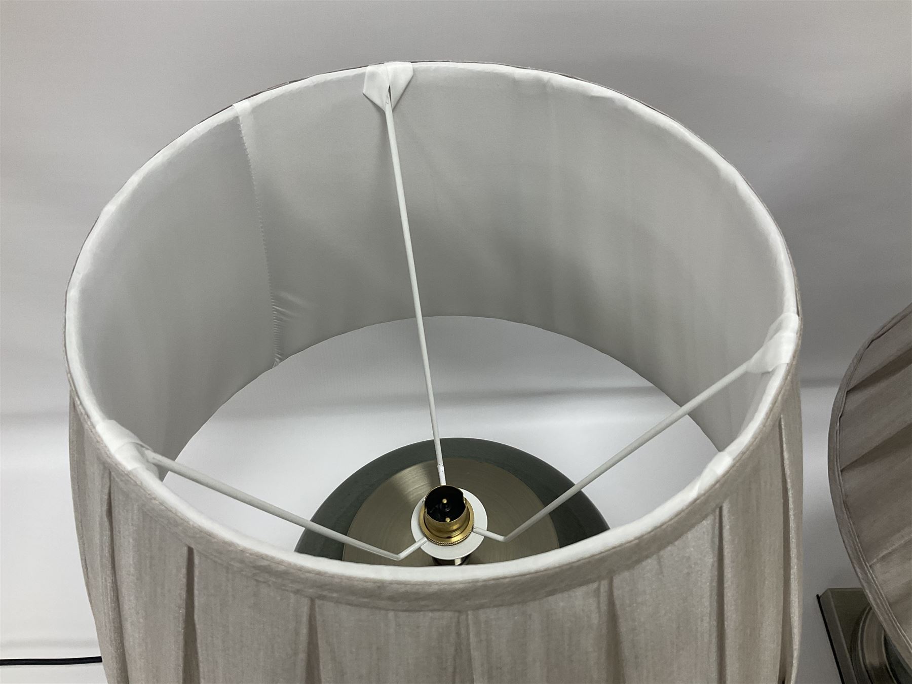 Pair of table lamps of squat baluster form, with a crackle glaze to a dark grey ground, upon a square base, including shade H57cm