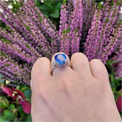 French 18ct white gold and platinum three stone unheated Ceylon sapphire and diamond ring, the single mixed cushion cut sapphire of 8.49 carat, with Gem Paris report, flanked by pear cut diamonds, hallmarked, total diamond weight approx 0.60 carat