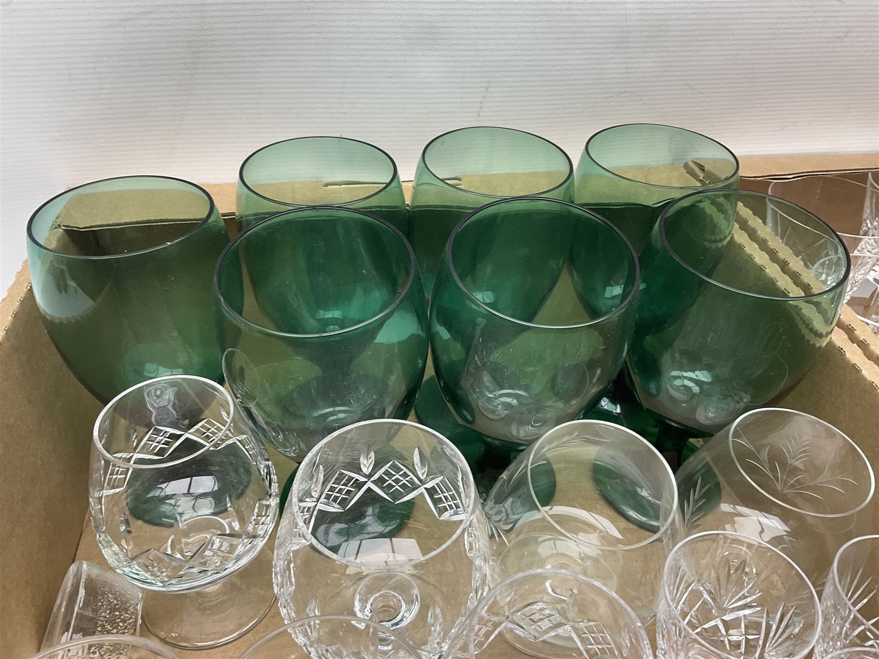 Quantity of glassware to include Mats Jonasson koala paperweight, set of six Stuart drinking glasses, seven green wine glasses with ovoid bowls, decanter, brass lamp etc