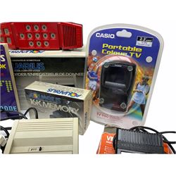 Mattel Aquarius Home Computer System c1982/3, with Mini-Expander, Data Recorder and 16K Memory, all boxed, and two instruction booklets; Grandstand Invader From Space and Palitoy Merlin electronic games; unopened blister packed Casio Portable TV-980; and quantity of game accessories