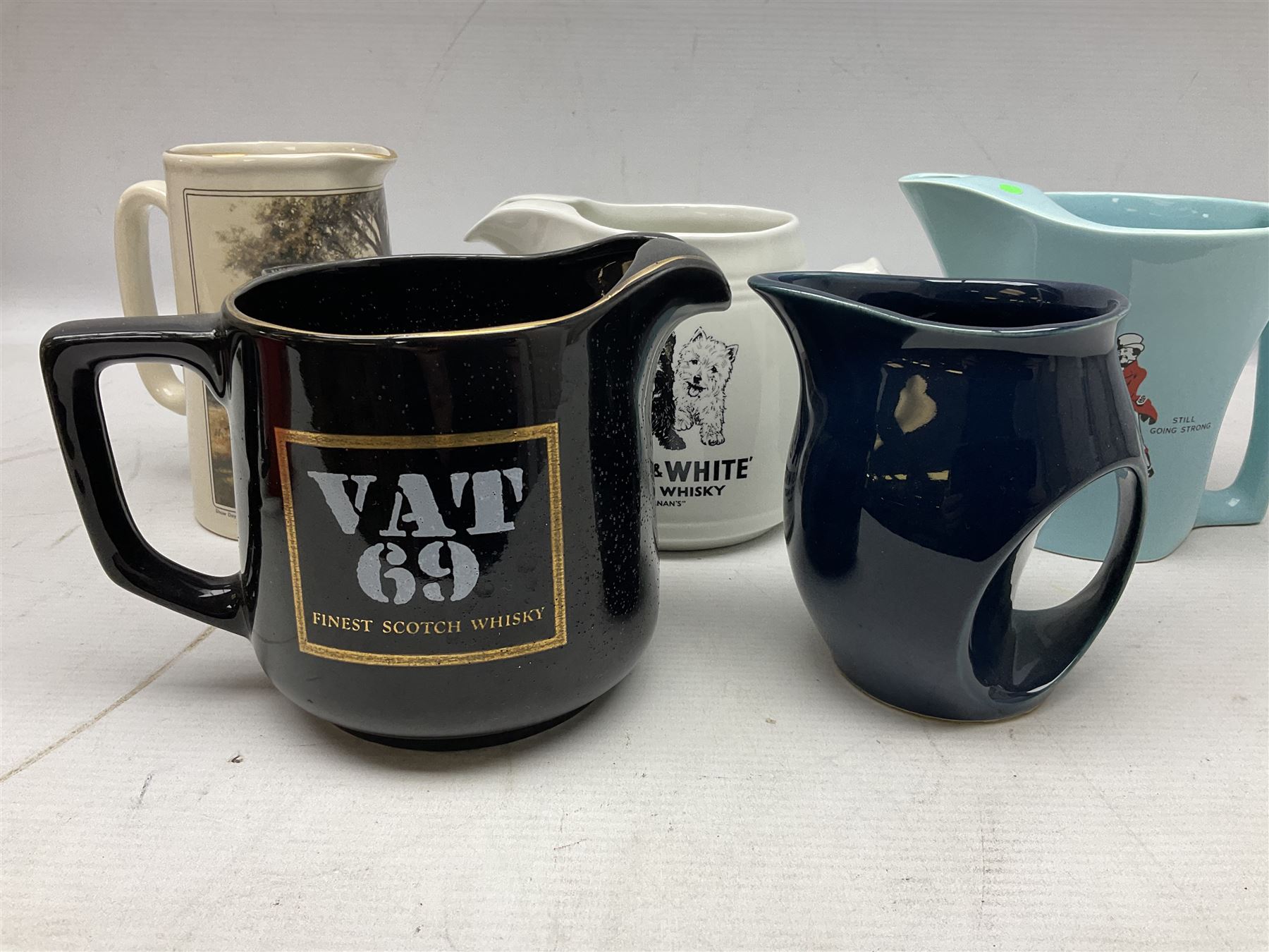 Six whisky water jugs, to include Wade Johnnie Walker, Haig, Black & White, etc