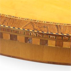 Early 19th century Sheraton revival satinwood oval table, shell motif to the centre bordered by walnut veneer, with inlaid banding, supported on square tapering legs terminating in brass feet