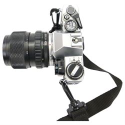 Olympus OM10 camera body serial no. 2279129, together with an Olympus OM-System S Zuiko Auto-Zoom 35-70mm 1:4 lens serial no. 283352, a Paragon 1:5.6 f=300mm 62 lens serial no. 12053, Hoya HMC Tele-Auto f-135mm 1:2.8 52 lens serial no. 638199, Tokina SD 70-210mm 1:4-5.6 52 serial no. 8844630, Olympus OM winder 2, Colly miniature/spy camera and other accessories in a Fotima carry case