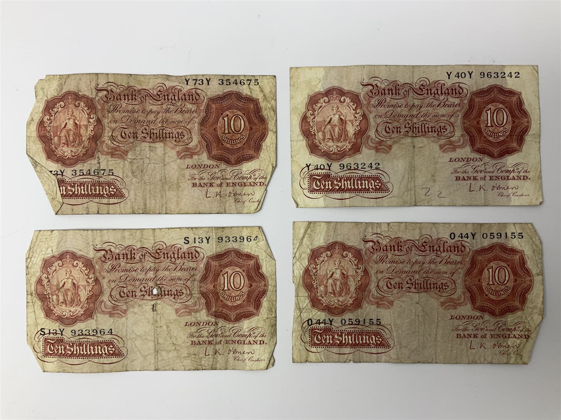 Banknotes including four Bank of England O'Brien one pound notes 'Y52J', 'T44J', 'T92J' and 'S23J', various ten shillings, two Somerset ten pounds 'CU20' and 'AW12', Page one pound notes, Bank of Scotland and other Scottish one pound notes etc