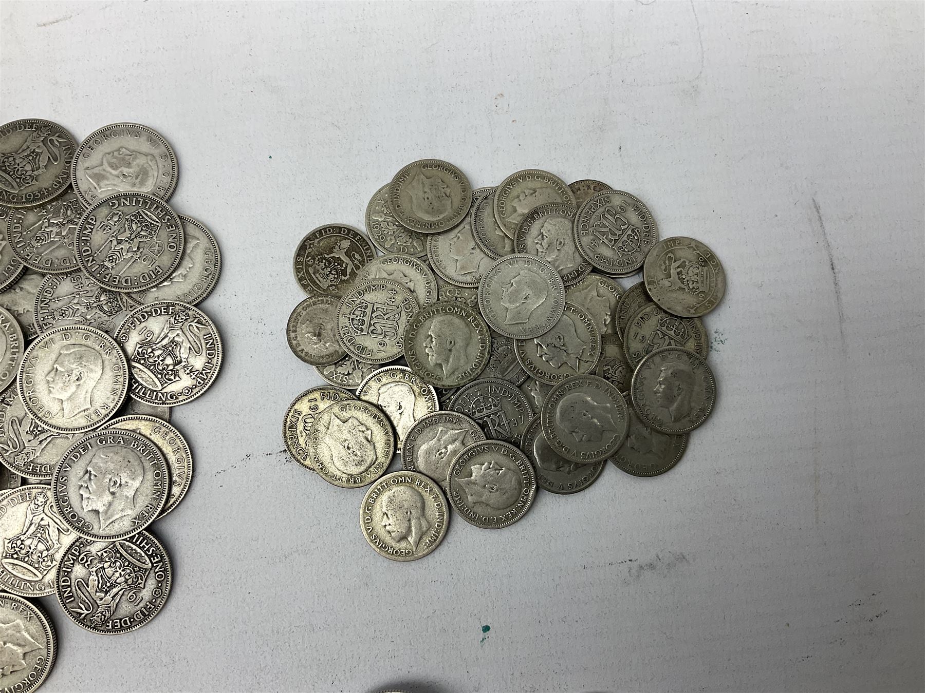 Approximately 1800 grams of Great British pre 1947 silver coins, including halfcrowns, florins, shillings etc