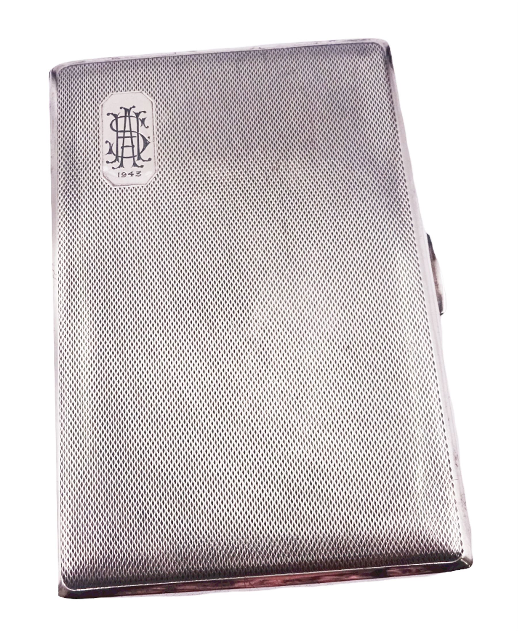 1940's silver cigarette case, with engine turned decoration and engraved monogram to panel to upper left corner, hallmarked Smith & Bartlam, Birmingham 1941, H12.5cm, approximate weight 6.09 ozt (189.5 grams)