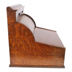 Victorian oak perpetual calendar roll-top desk, tambour front enclosing fitted interior with pigeonholes and pen trays, the raised back fitted with rotating date and month apertures, over single frieze drawer with cast brass handle, on plinth base