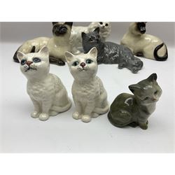 Ten ceramic cat figures, to include pair of Royal Doulton Siamese cats, four other Royal Doulton examples and four Beswick examples 
