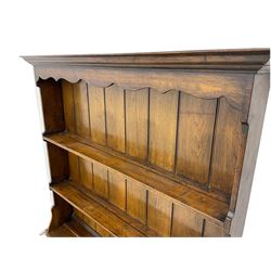 Georgian style oak dresser and rack, fitted with two drawers and two cupboards, carved diamond detail