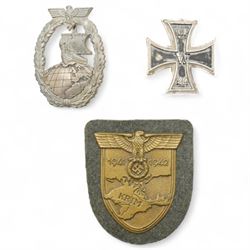 German Third Reich Krim shield arm badge 1941-1942, Auxiliary Cruiser badge and a WWI first class Iron Cross with field conversion (3) 