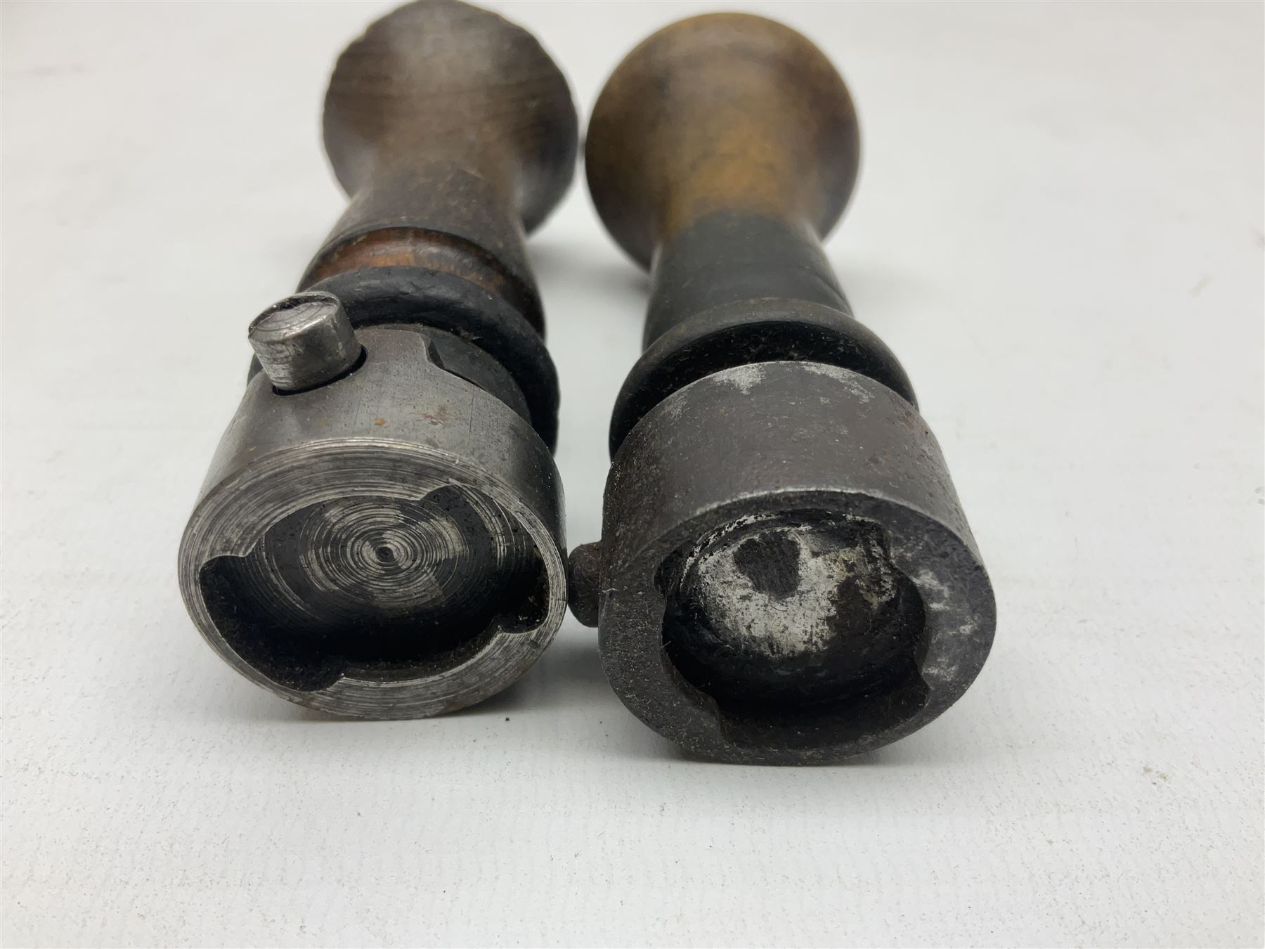 Two Post Office hand stamps 'Heversham Milnthorpe Cumbria' and 'Cimla Neath', together with two hand stamp bodies and various date numbers, housed in a fitted box