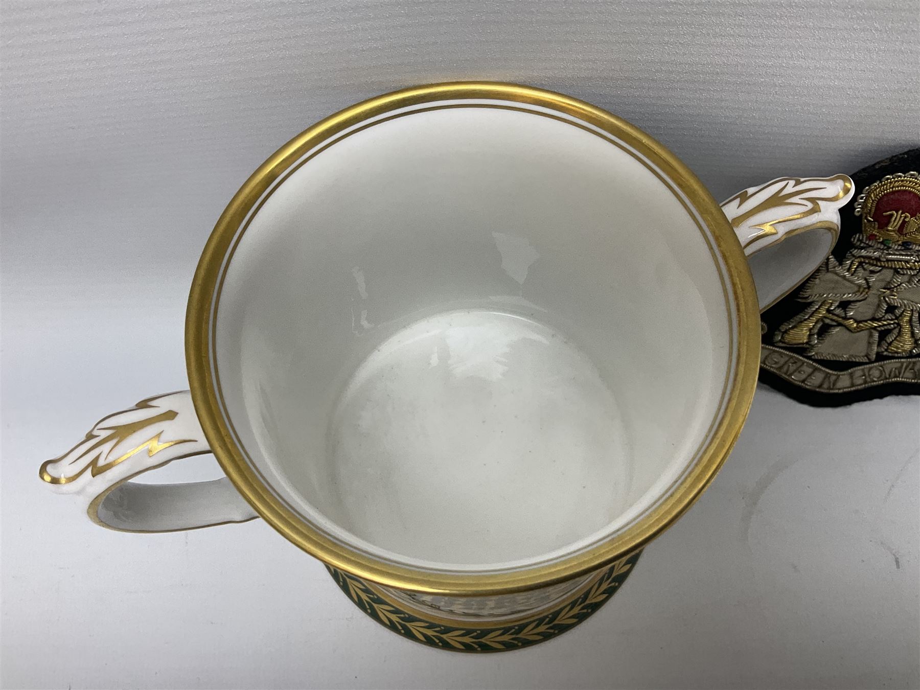 Limited edition Spode Green Howard's twin handled loving mug, no 205/300, with certificates, together with a Green Howards cased Tercentenary medal (1688-1988), cap badge and embroidered patch, largest H11.5cm