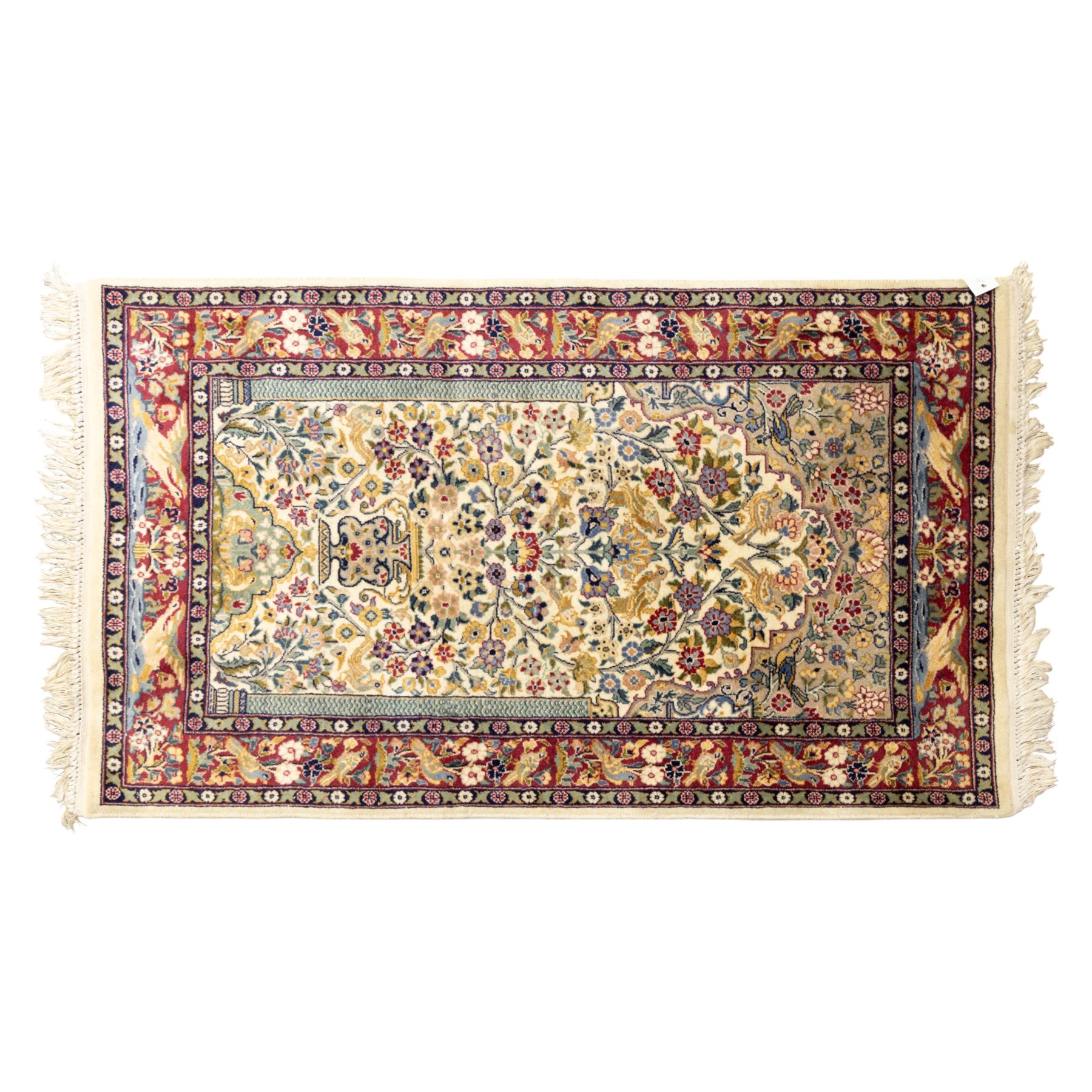 Two Central Persian rugs, ivory ground with a symmetrical foliate and floral design around a shaped cartouche medallion with a red floral and bird motif border with contrasting guard stripes, 142x76cm, Central Persian Kashan rug, crimson central field with a floral and foliate design with a stylized rosette medallion incorporating palmettes and scrolling vine work, enclosed by a dark navy border and multiple guard stripes, 117x68cm, (2)