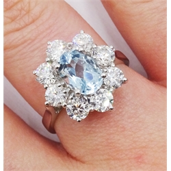 18ct white gold oval aquamarine and round brilliant cut diamond cluster ring, hallmarked, aquamarine 1.30 carat, total diamond weight approx 1.60 carat