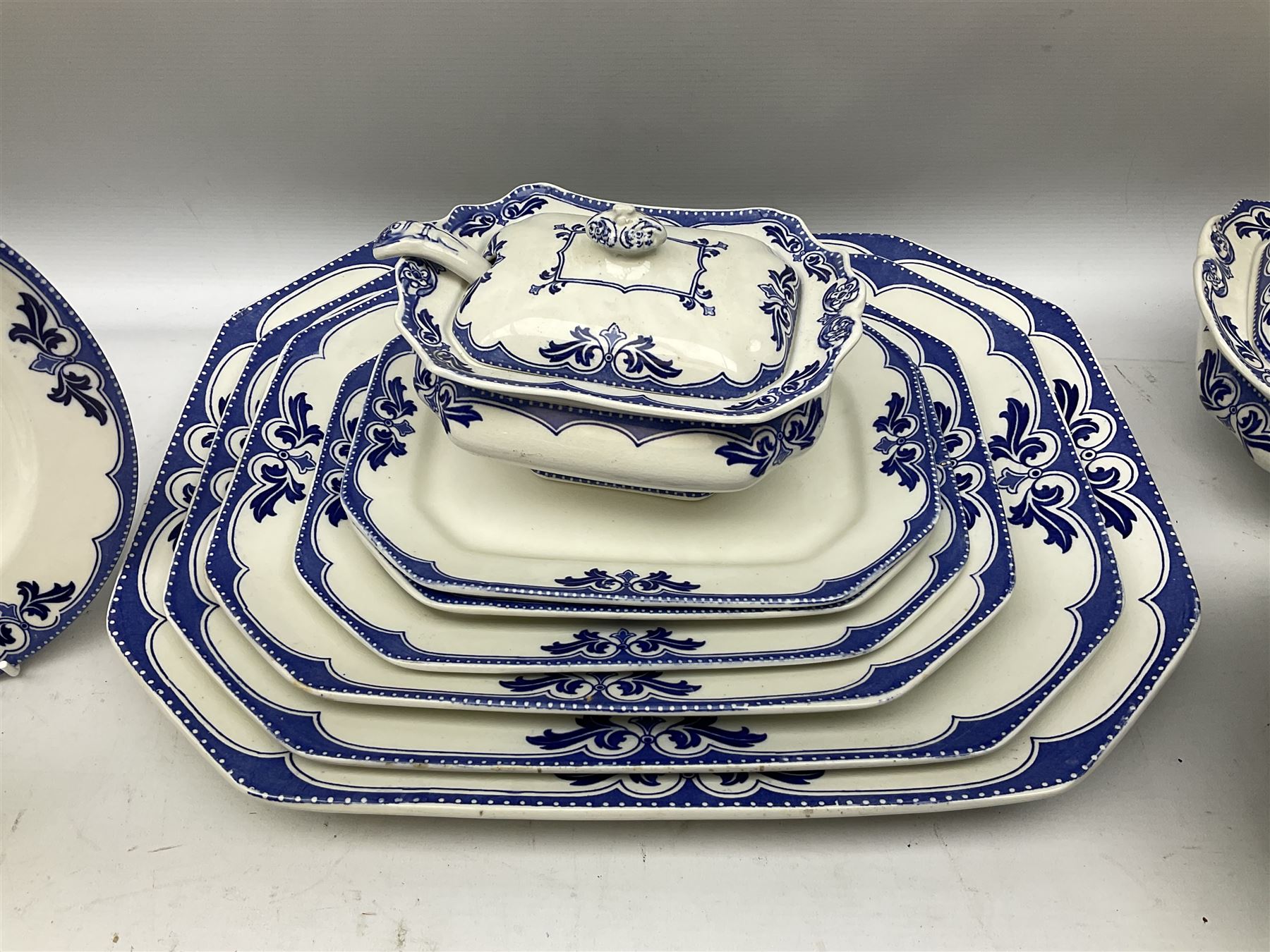 Burgess and Leigh Middleport pottery dinner wares decorated in the ‘Milford’ pattern, to include lidded tureens, graduated meat plates, dinner plates etc 