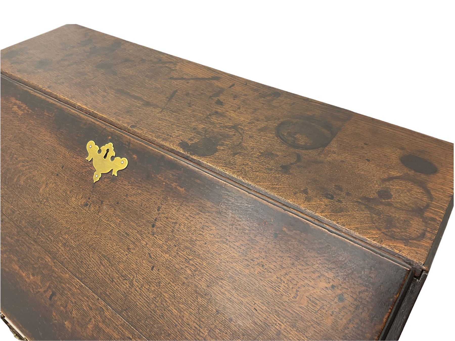 Georgian oak bureau, fall front enclosing fitted interior, four long graduating drawers, on bracket feet