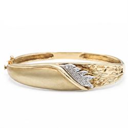 14ct yellow and white gold cubic zirconia abstract design hinged bangle, stamped 585