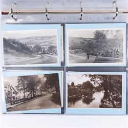 Four-hundred and twelve early 20th century Whitby District view real photographic postcards, including a selection from the Whitby Coast (176), starting at Staithes and Runswick Bay down to Robin Hoods Bay and a selection from the Valley of the River Esk (236), including Ruswarp, Rig Mill, Sneaton, Sleights, Grosmont, Egton, Glaisdale, Danby, Castleton and Goathland, all housed within two postcard albums