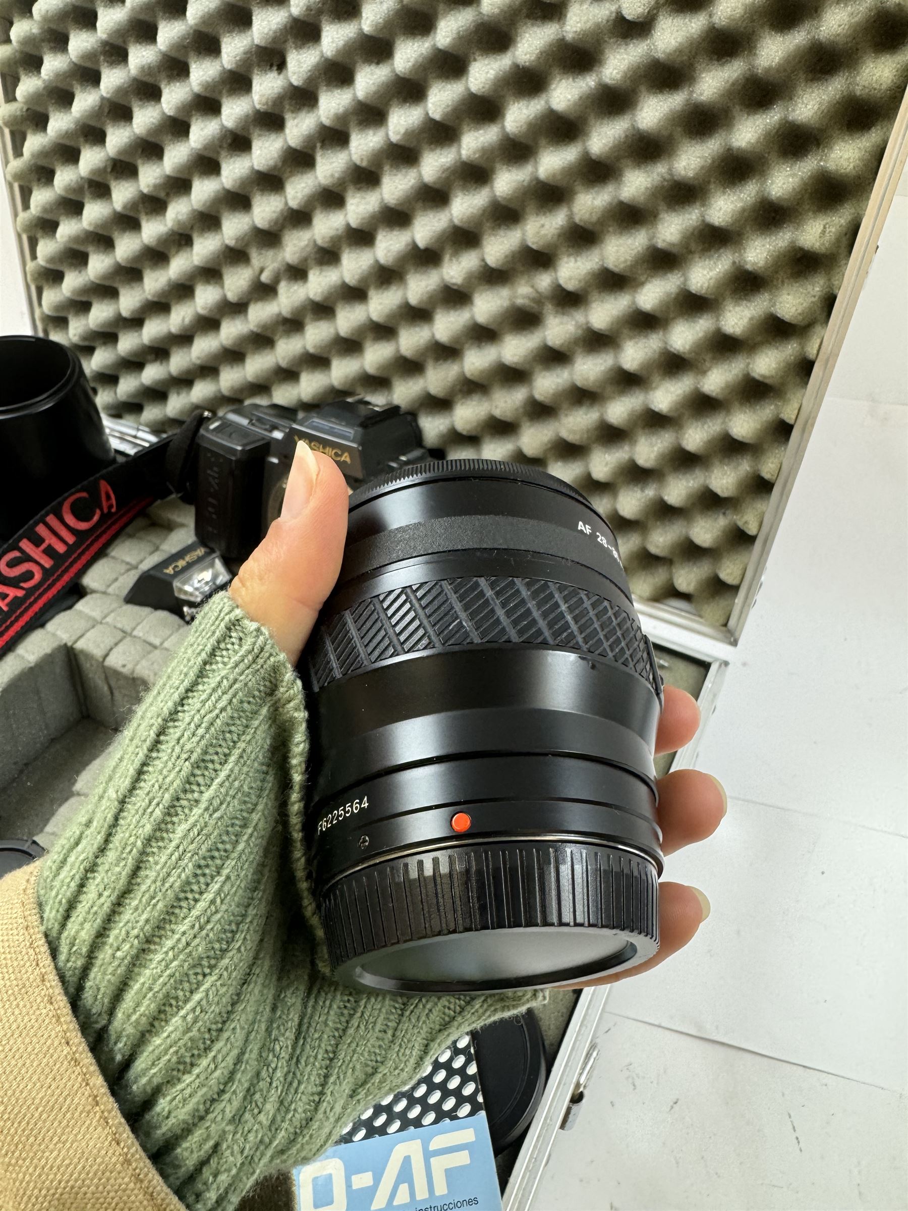 Yashica 230-AF camera outfit, including camera body serial no. 0184693, three Yashica lenses comprising AF 70-200mm 1:4.5 serial no. F6162003, AF 28-85mm 1:3.5-4.5 macro lens serial no. F6225564 and an AF 75-300mm 1:4-5.6 Macro lens serial no. F7100913, flash, hood and other accessories and instruction booklet, contained within a silver flight case 