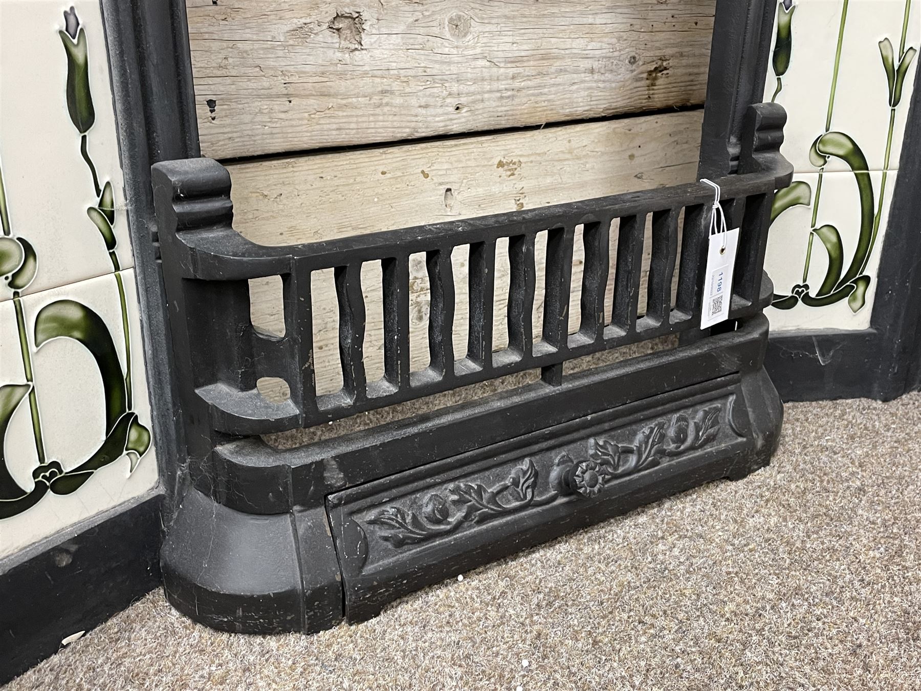 The Gallery Collection Fireplaces - 'Edwardian' cast iron fireplace, the hood decorated with interlacing floral design, with Art Nouveau inspired upright tiles