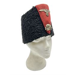 WW2 German small size Balkan style hat with 'SS' metal badges; red cloth top and flash to front with black persianelle type sides; lined in brown card with leather sweatband