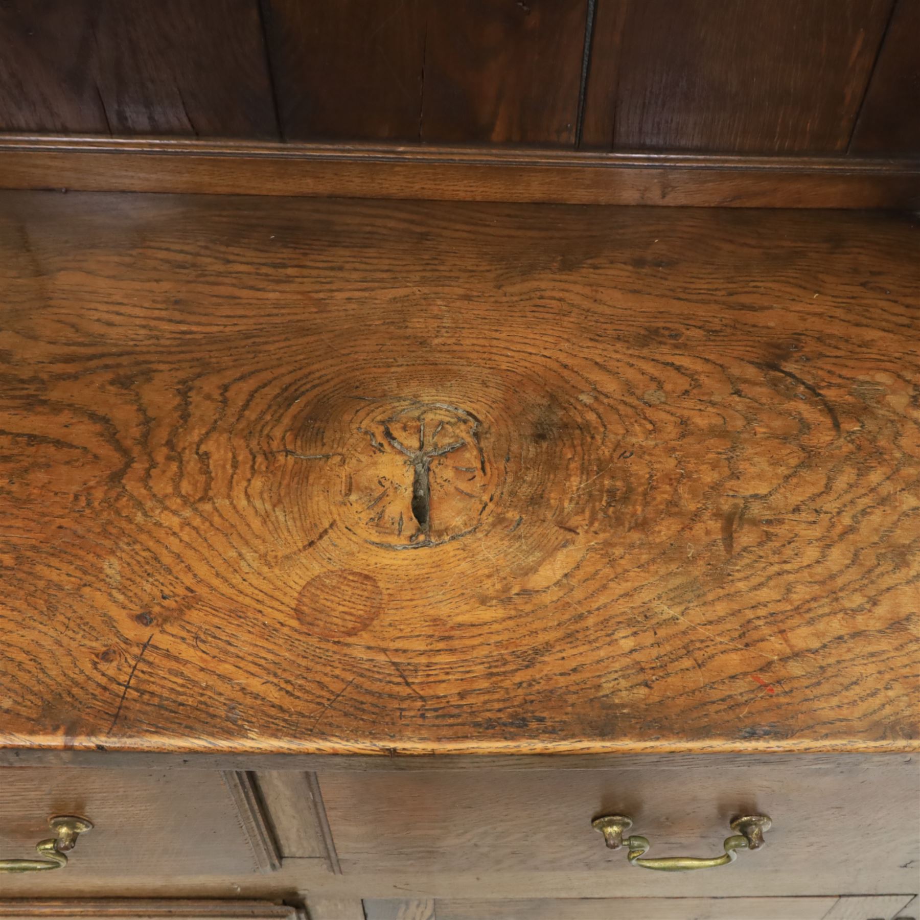 Georgian design oak dresser, the raised plate rack with shaped sides and two open shelves, upon a dresser base fitted with six drawers and two cupboard doors, and short block feet 