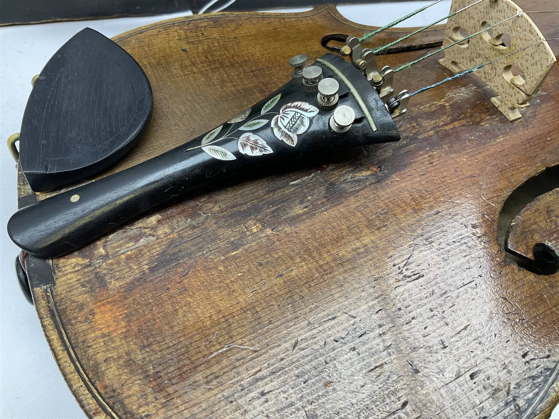 Late 19th century German violin with 36cm two-piece maple back and ribs and spruce top; bears label for 'Thomas Jacklin Violin Maker & Repairer Hull 1879'; 60cm overall; in ebonised wooden coffin case.