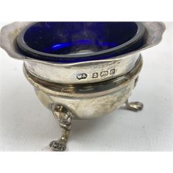 Group of hallmarked silver to include inkwell stand stamped Birmingham 1912, with scalloped edged detail and trefoil feet, together with a silver salt stamped Birmingham 1904 with blue glass liner, raised on three claw feet, glass rectangular jar with silver engraved lid and floral detail ring, silver total weight approx 100g