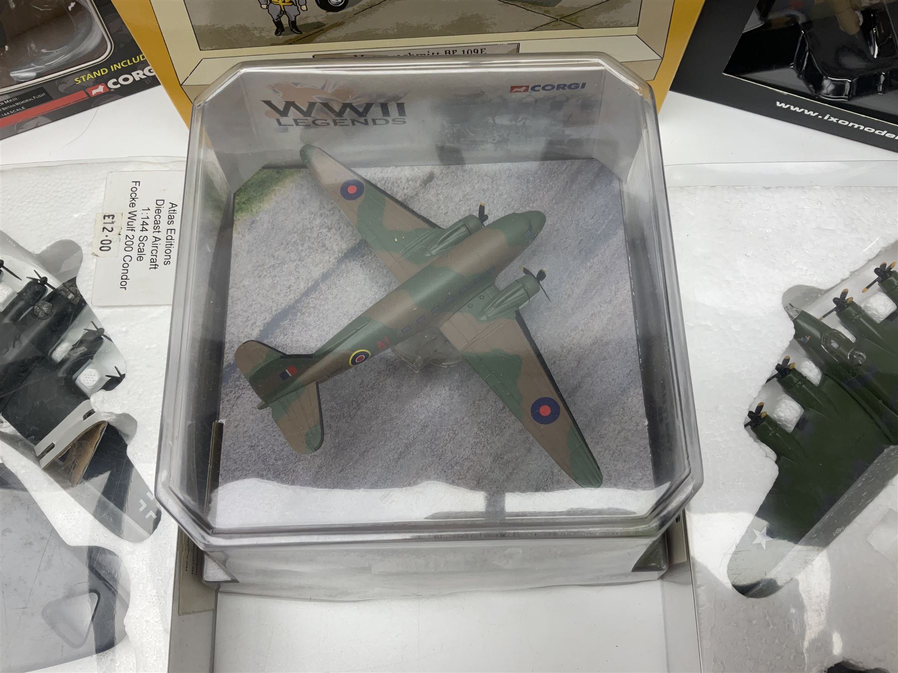 Fifteen modern die-cast models of aircraft by Corgi, Atlas Editions and Ixo including Aviation Archive, War Birds, Fighters of WWII etc; and model of an MGB Sports Car; all boxed (16)