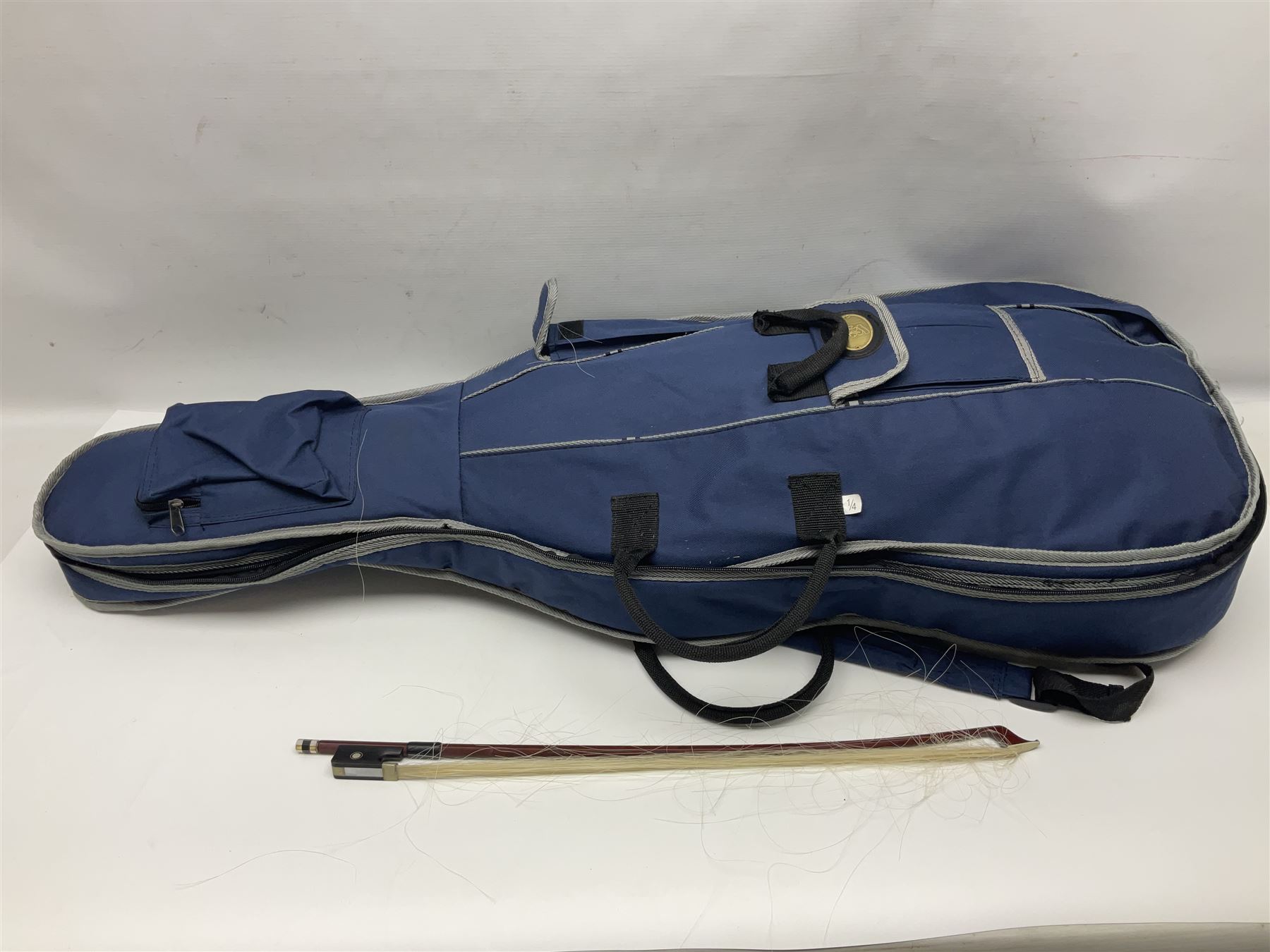 Stentor Student I quarter-size cello with 59.5cm two-piece maple back and ribs and spruce top; bears maker's label with serial no.M072648 L95.5cm overall; in Stentor soft carrying case with bow