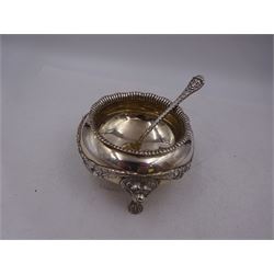 Early 20th century silver open sucrier, of circular form, with fluted gadrooned rim and decorated in relief with floral swags, united by three lion mask mounts and upon three paw feet, hallmarked Z Barraclough & Sons, London 1912, H6cm, D11cm, with similar spoon with lion mask finial, hallmarked London 1912, maker's mark indistinct