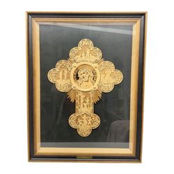 Cork carving of a religious cross depicting intricate scenes of various religious figures and motifs amongst trees and foliage, with central circular panel of Jesus Christ, in glazed frame, H95cm