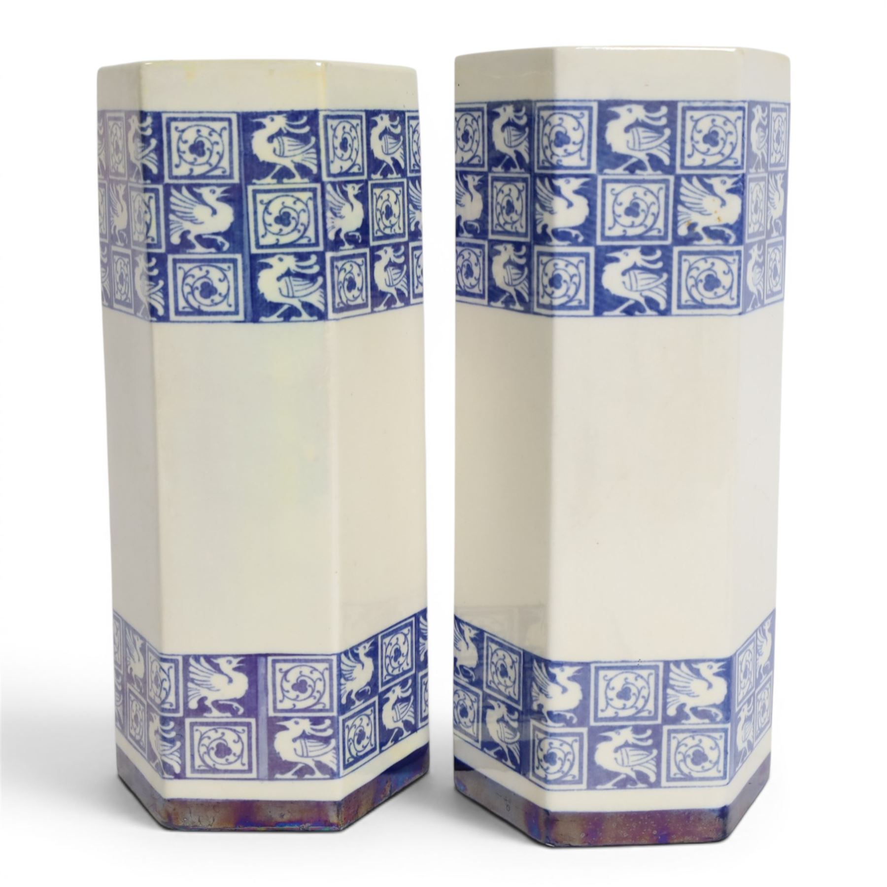 Pair of 1920's Art Deco Royal Doulton lustreware hexagonal vases, with boards of checkerboard design of alternating bird and scroll motifs, designed by Reco Capey, H28cm