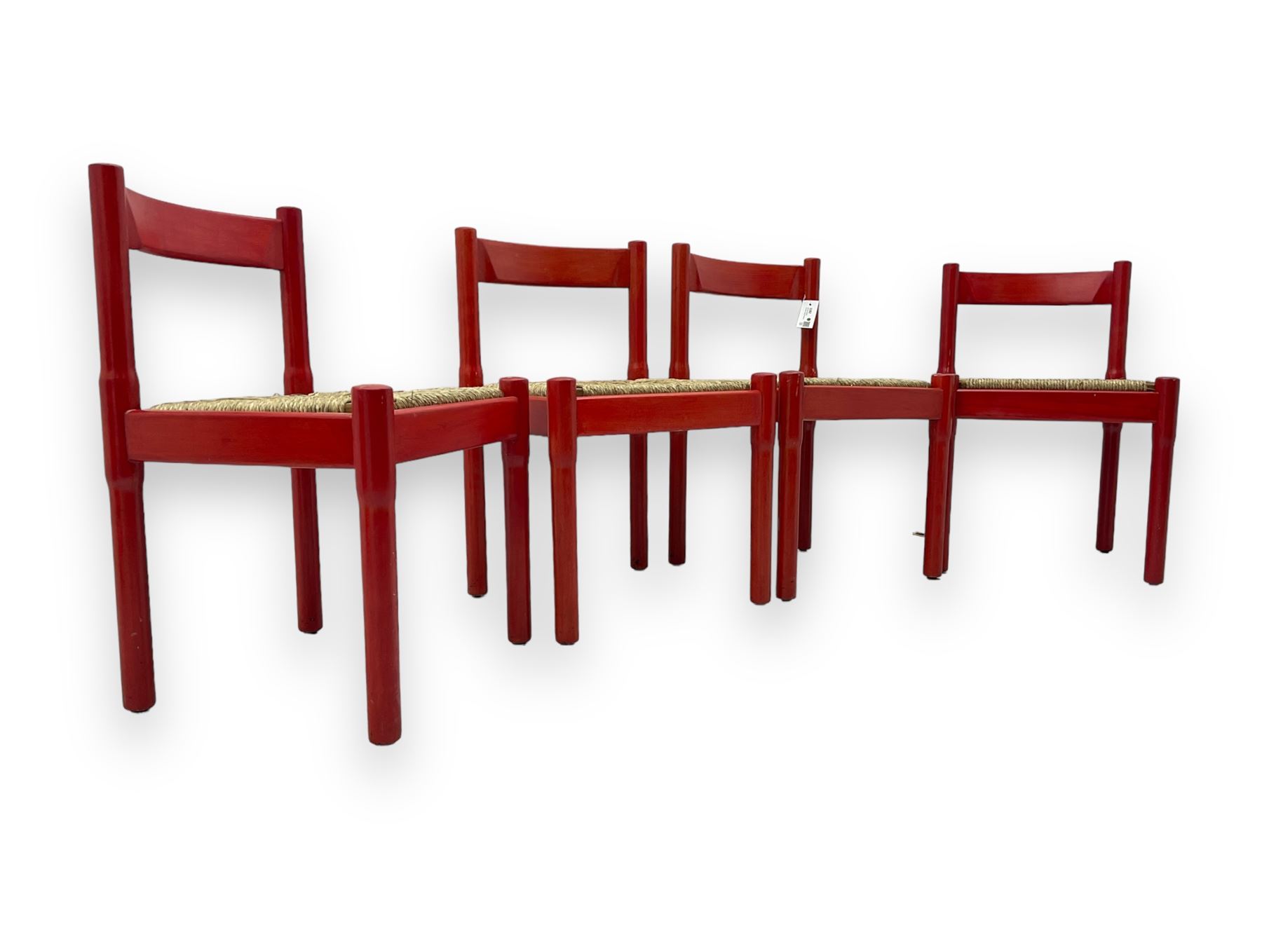Vico Magistretti - mid-20th century circa. 1970s set of four beech framed dining chairs in red finish, with drop-in rush seats