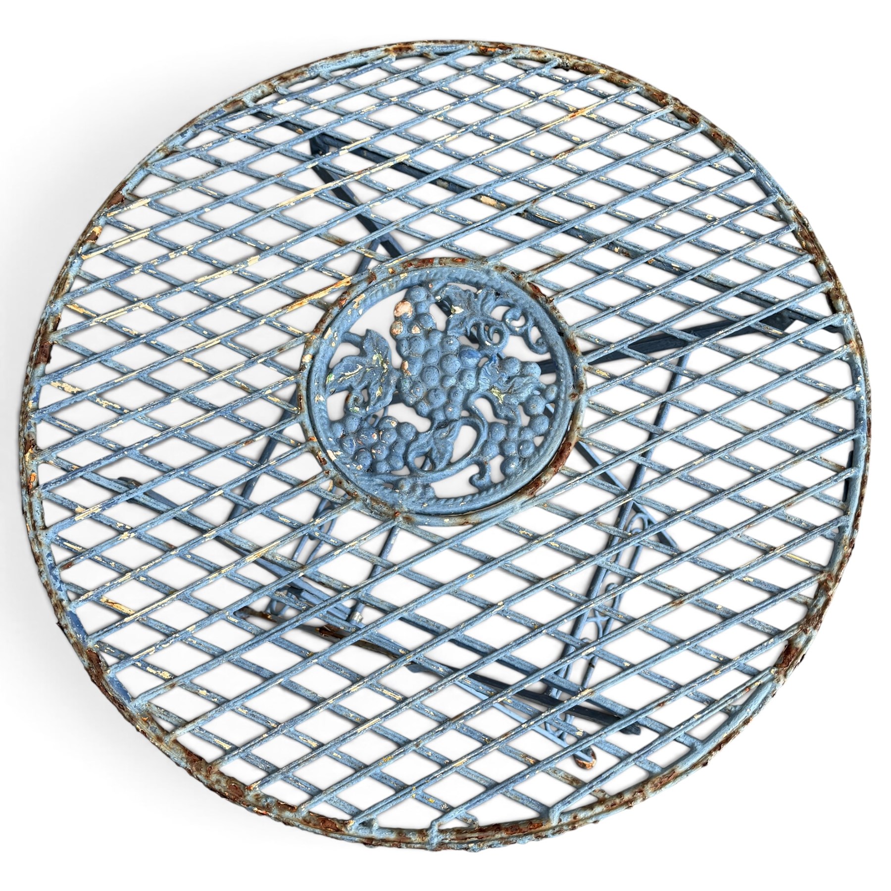 Three-piece French style blue-painted wrought iron garden bistro set, comprising a circular folding table with latticework top and central fruiting grapevine medallion (W71cm H76cm) and matching pair of chairs, with scrolling cresting rail and grapevine motif over folding X-frame base (W40cm H98cm)