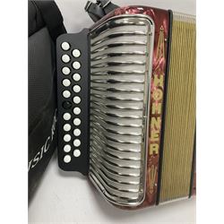 Hohner Double Ray black dot button melodeon in B/C; modern Irish style with eight bass and twenty-one treble buttons and double strap, with soft carrying case