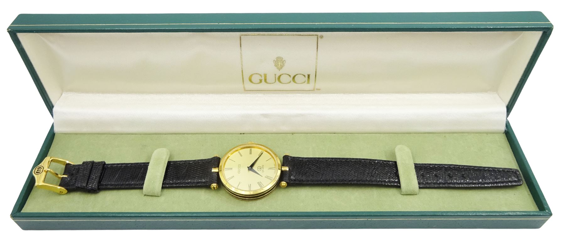 Gucci Shelly Line quartz wristwatch, gilt dial with GG logo back case, boxed