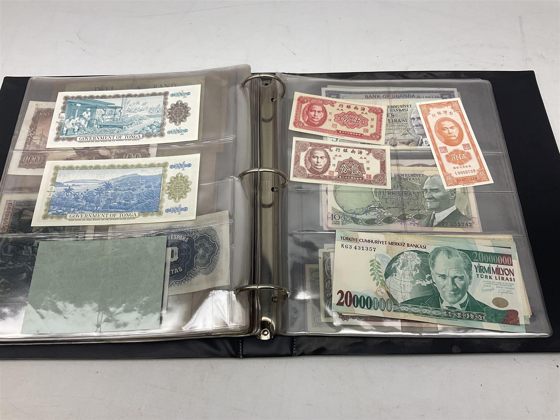 World banknotes, including Queen Elizabeth II The States of Jersey one pound 'DB202703', five pounds 'BB527762' and ten pounds 'AB651481', reserve bank of New Zealand two dollars '1L3 741894', King George V Straits Settlements one dollar 1st January 1935 'F/83 28924', various Bank of England notes etc, housed in two ring binder albums