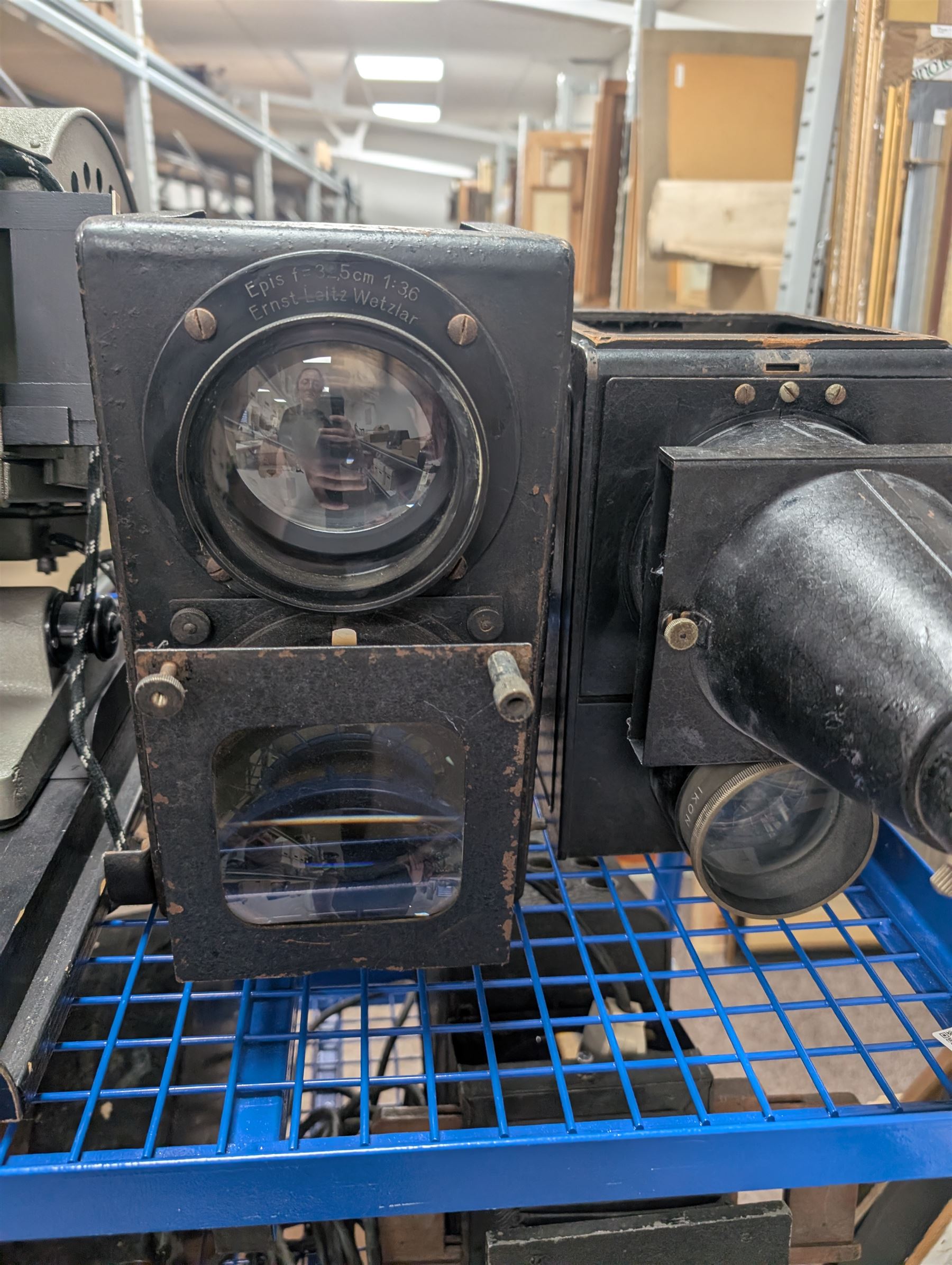 Collection of projectors, epidiascopes, magic lantern and similar, including Bell & Howell 621 projector, mahogany and brass magic lantern, Helper 6S projector, Leitz epidiascope, Zeiss epidiascope, Johnson Optiscope, etc
