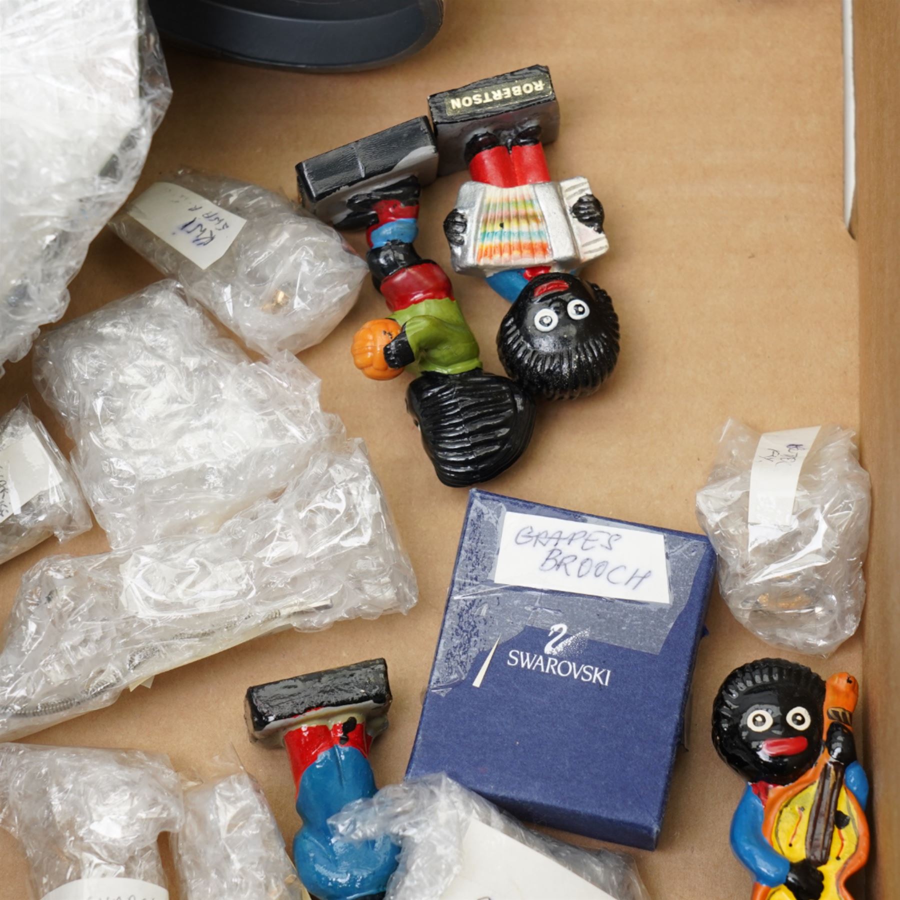 Collection of Swarovski figures, including Grapes brooch, dog, nativity scene etc, and approximately 13 Golly figures