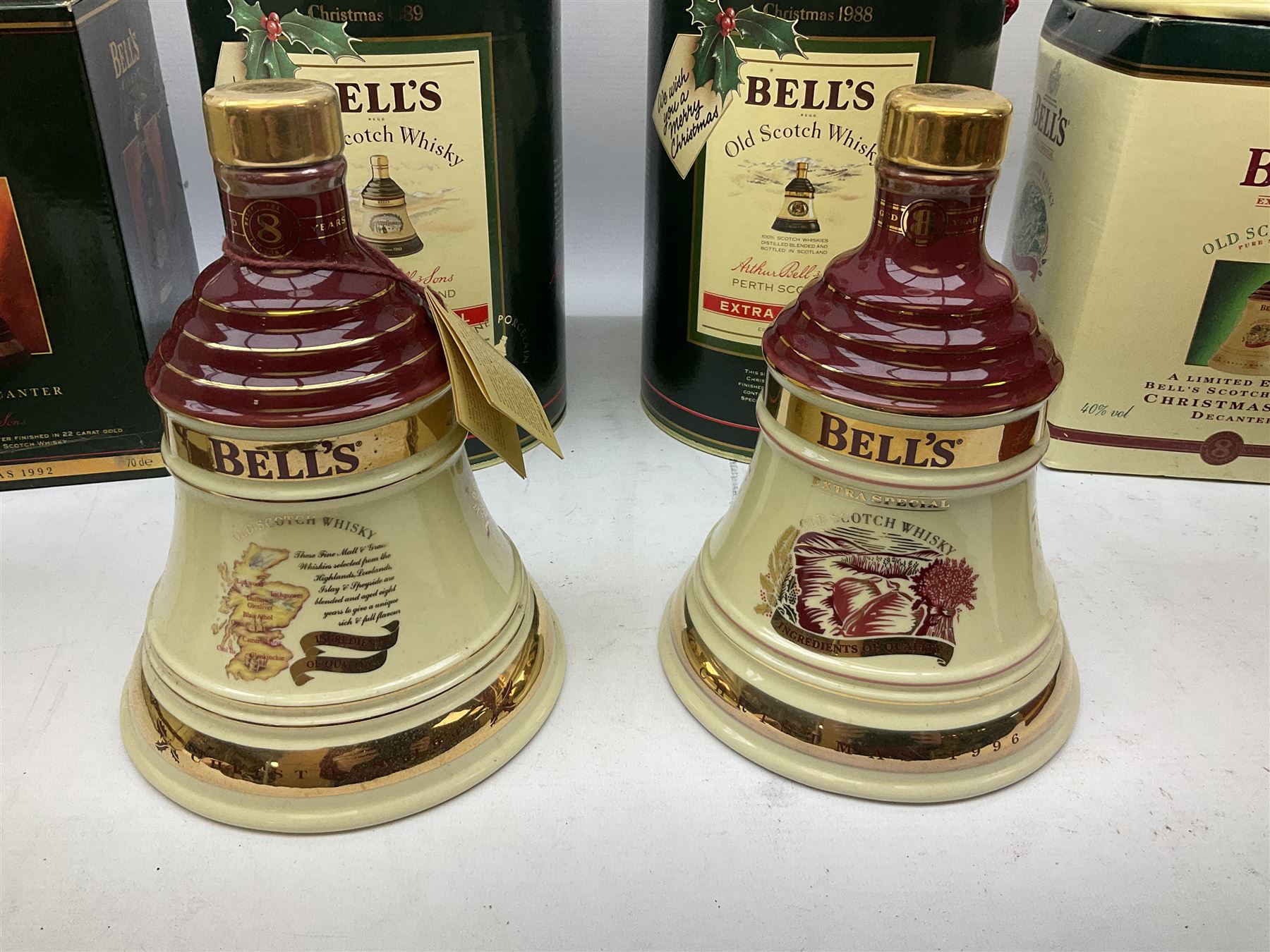 Six Bell's Old Scotch Whisky Christmas ceramic decanters comprising 1988, 1989, 1992, 1996, 1997 and 1998 all in original boxes and decanter seals intact 