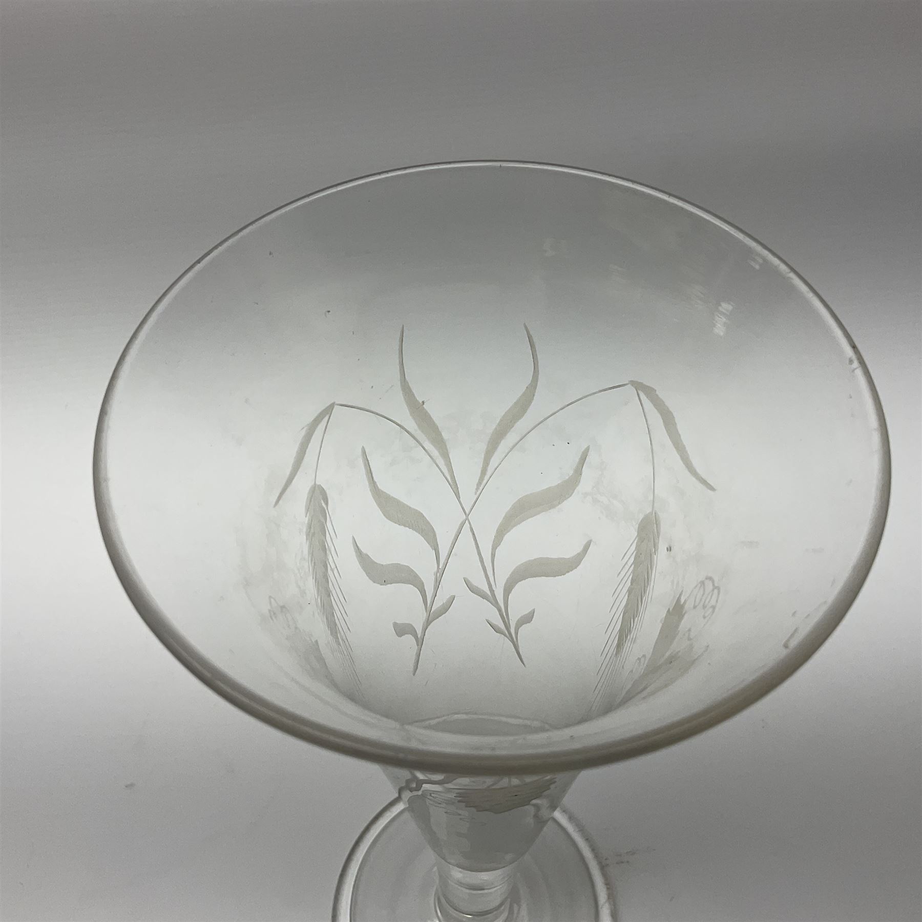 Georgian ale glass, the bowl of tapered form with fluted rim, etched with hops and barley, upon slightly tapering stem and circular domed and folded foot, H30.5cm