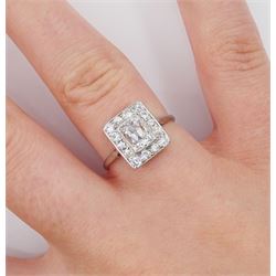 Art Deco platinum and white gold milgrain set diamond ring, circa 1920's, the central cushion cut diamond of approx 0.90 carat, with old cut diamond surround, total diamond weight approx 1.10 carat