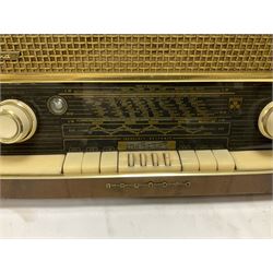 Three mid 20th century radios comprising 1950s Grundig wood cased valve radio model 3028/GB, together with a 1970s Grundig Type RF 153 CS 150 radio in teak case, and an Ekco 355 1960's valve radio, largest W60 H35cm D23cm