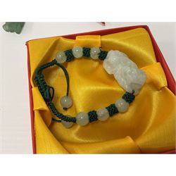 Collection of jade jewellery, including green and yellow jade examples 