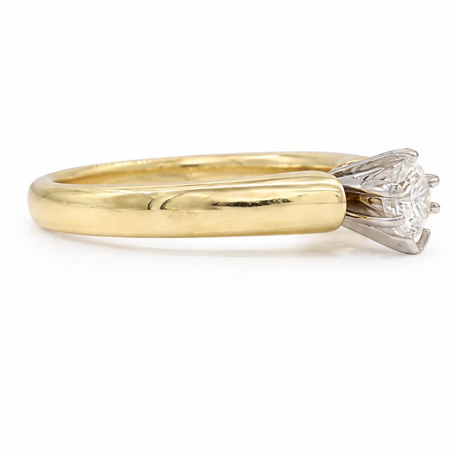 14ct gold diamond ring, claw set with a single pear cut diamond of 0.31 carat, stamped 14K, with IGI report